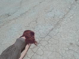 metaphor, falling down, failure, dry, stressed, cracked, panic, anxiety, broken, loss, woman, red hair, dress, laying down, falling, crisis, depression, down, injured, stumbling